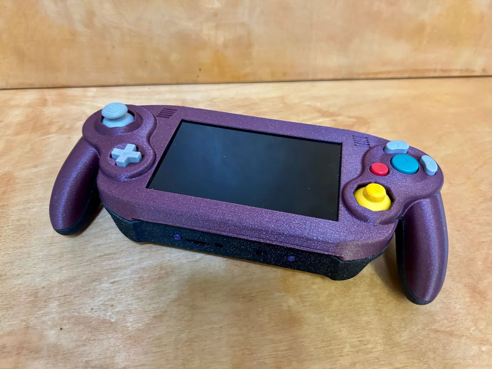 Finished handheld: GameCube-style controls around the built-in screen